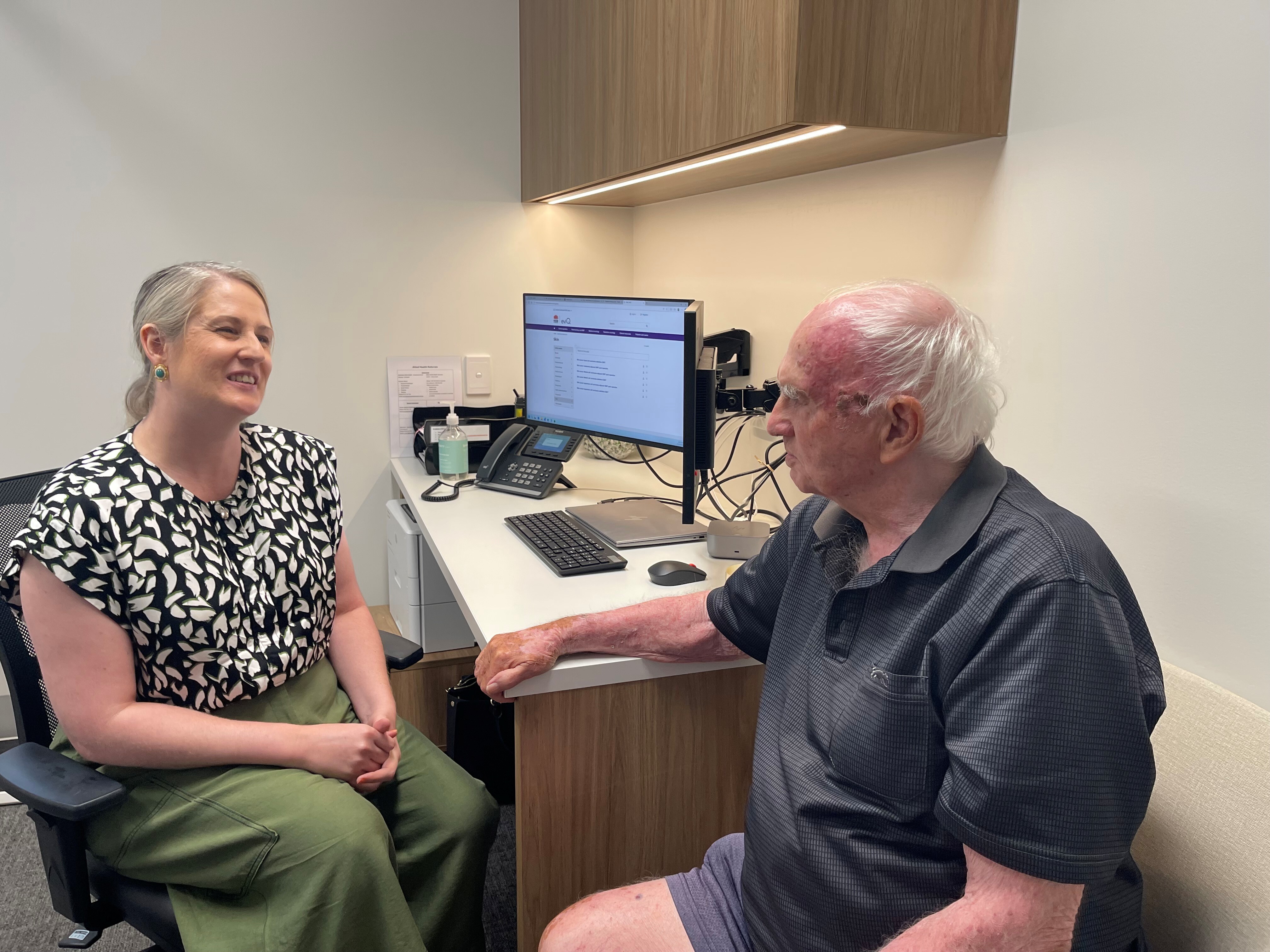 Dr Megan Carroll consulting with 94-year-old Lloyd